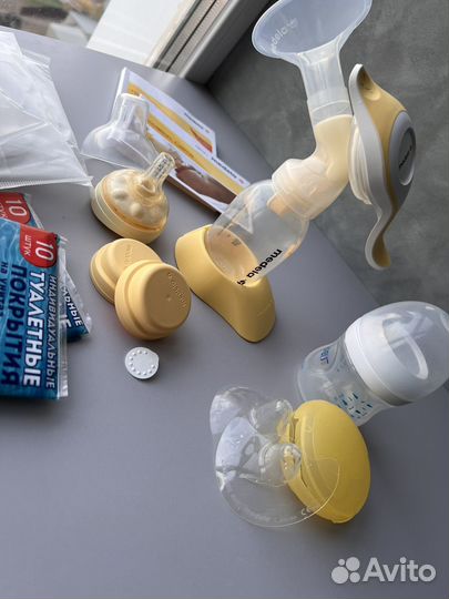 Молокоотсос medela ручной с соской, накладки
