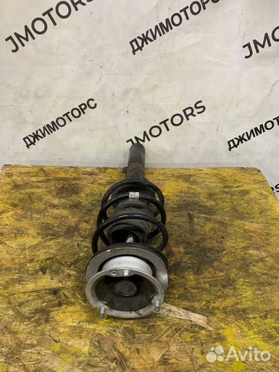 Стойка амортизатора передняя левая BMW E87