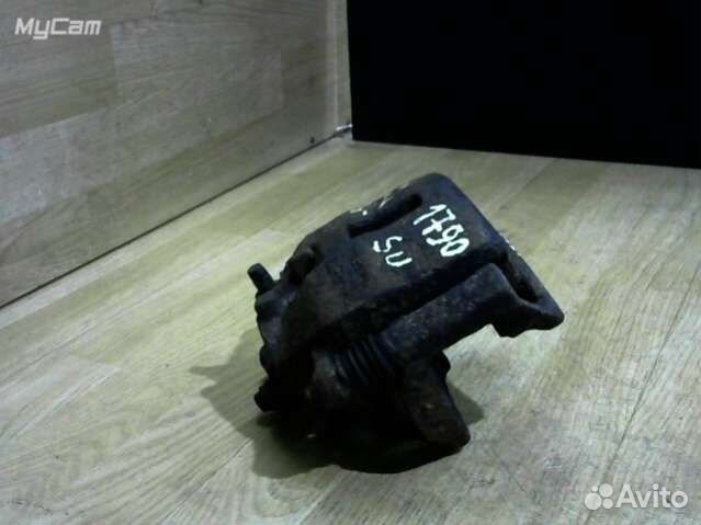 Суппорт тормозной передний левый Nissan Almera Tin