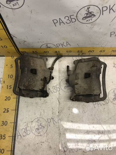 Суппорт передний Nissan Almera Classic B10