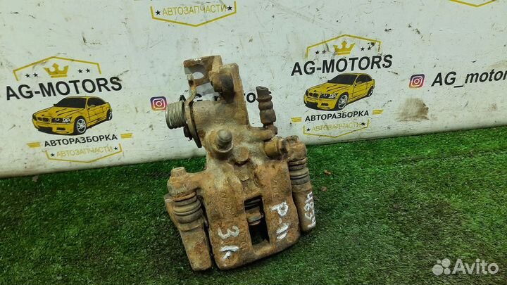 Суппорт задний левый Nissan Primera P11