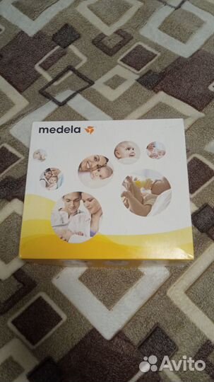 Молокоотсос medela mini electric