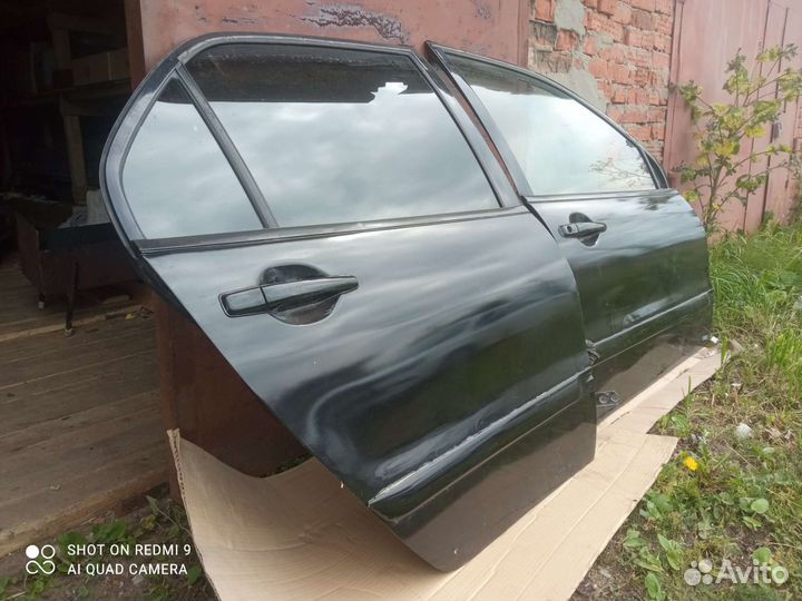 Двери на mitsubishi lancer 9