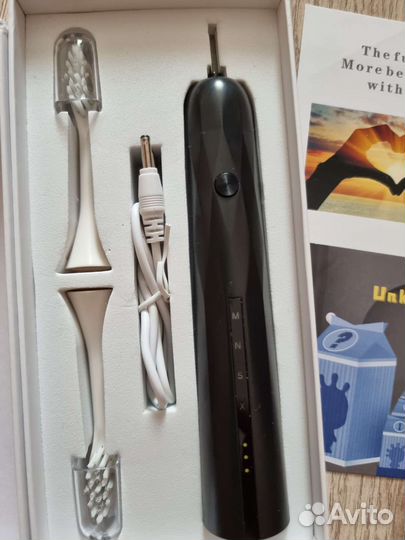 Электрическая зубная щетка