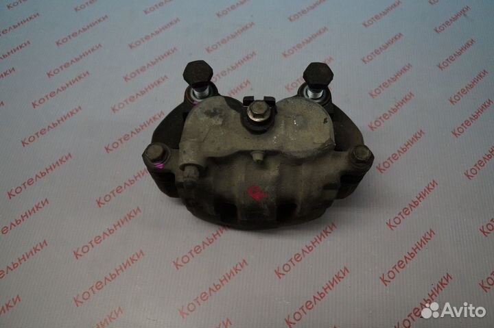 Nissan 41001-WF100 Суппорт тормозной правый