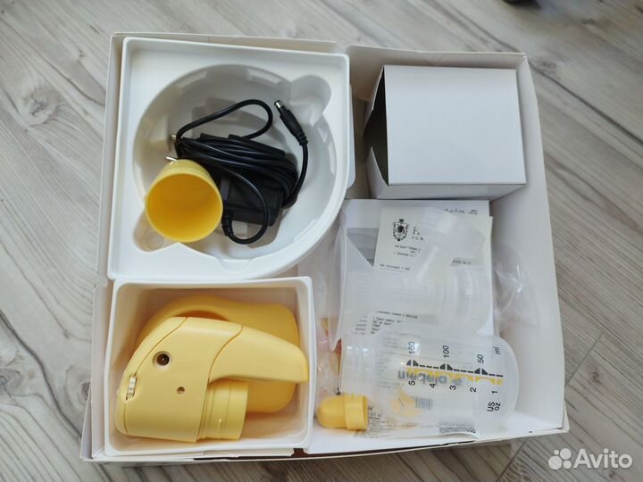 Молокоотсос medela электрический