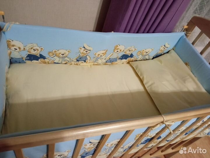 Детская кроватка с продольным маятником