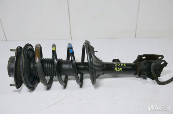 Стойка амортизатора передняя левая Kia Sportage 2