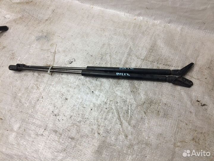 Амортизатор двери багажника Ниссан Марч 12