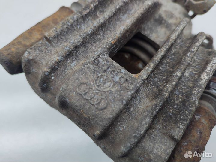 Суппорт тормозной задний левый Volkswagen Golf MK4