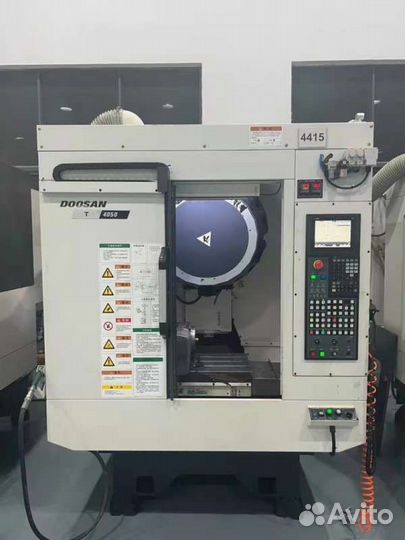 Фрезерный обрабатывающий центр doosan T4050