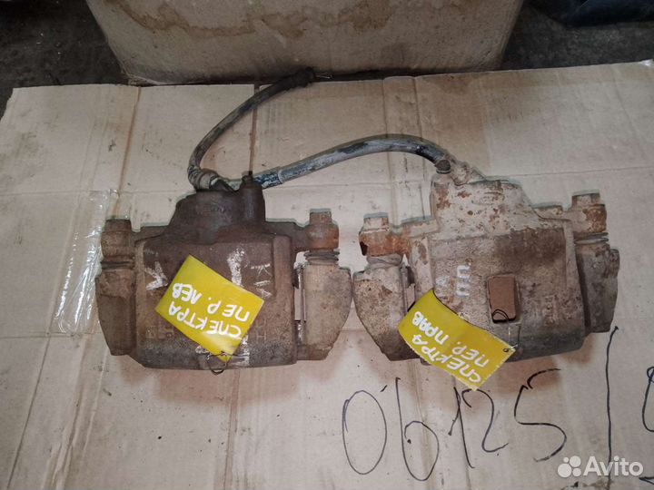 Суппорт передний левый, правый KIA Spectra