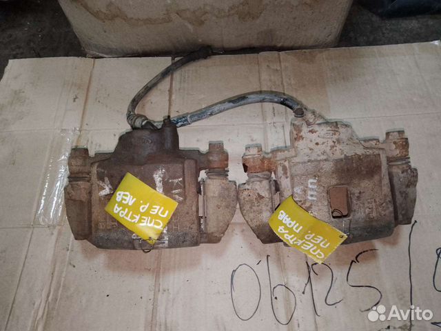 Суппорт передний левый, правый KIA Spectra