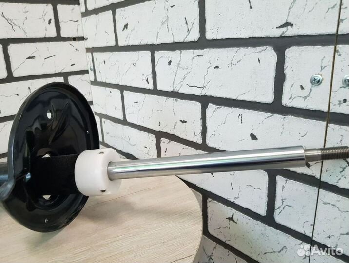 Амортизатор шевроле перед. лев. оригинал