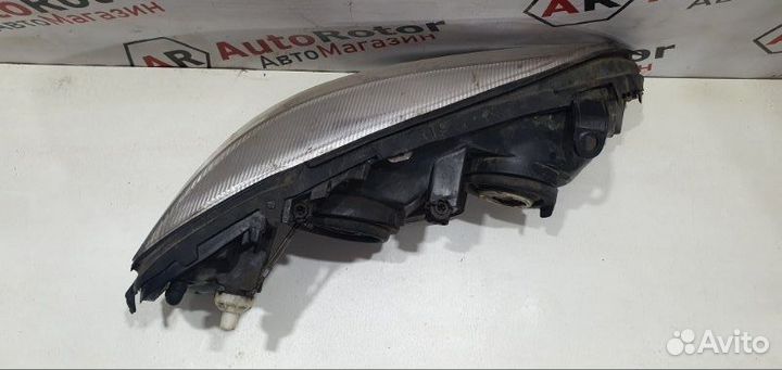 Фара галогеновая левая Opel Astra седан