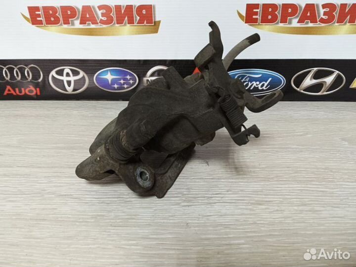 Суппорт тормозной задний левый Ford Focus MK1 eydc