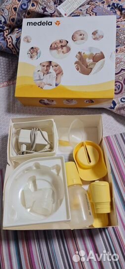 Молокоотсос medela электрический