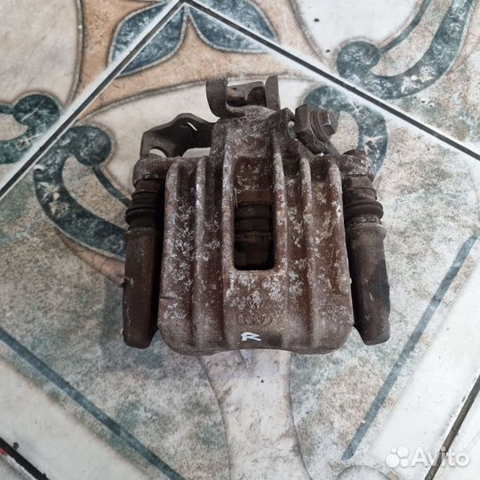 Суппорт задний Skoda Rapid