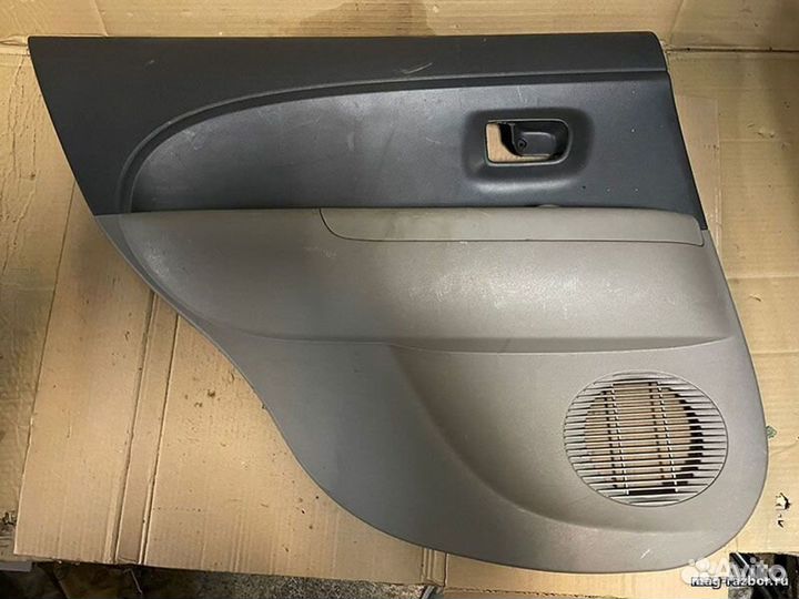 Обивка двери Toyota Passo I задняя левая