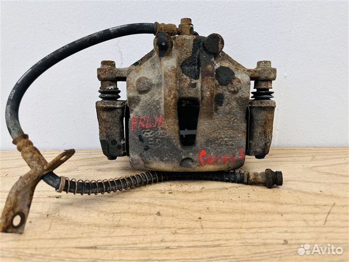 Суппорт тормозной передний левый Kia Cerato 2 1.6