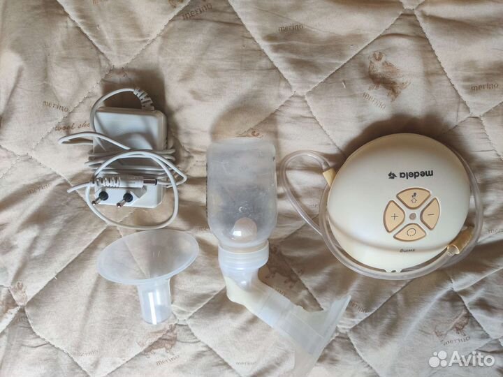 Молокоотсос medela электрический
