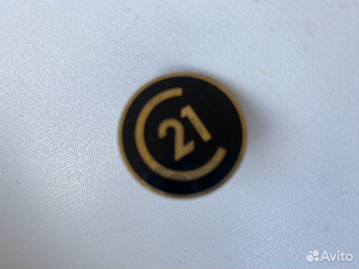 Значoк century 21