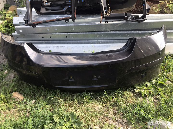 Бампер задний Opel astra h (черный)
