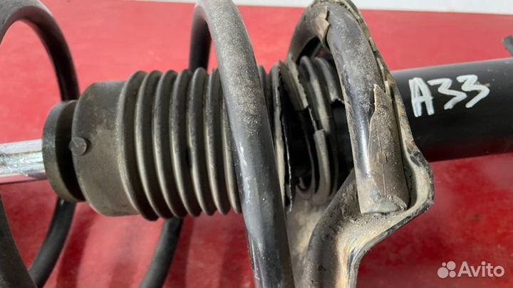 Стойка подвески передняя левая Nissan Cefiro A33