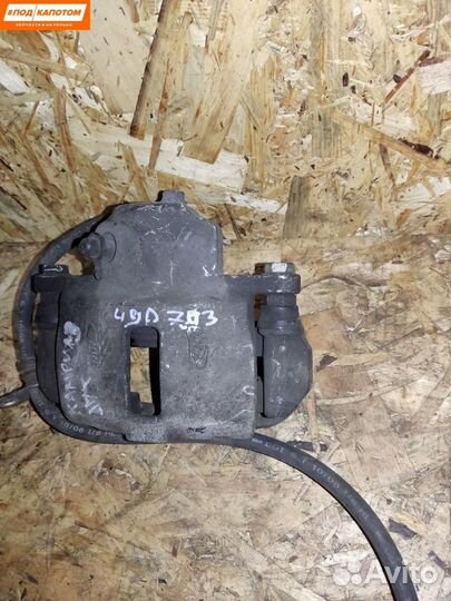 Суппорт тормозной задний левый Toyota Camry XV40