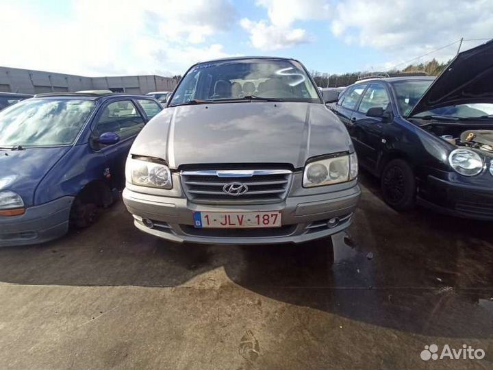 Замок двери передней левой Хундай Тражет 04г