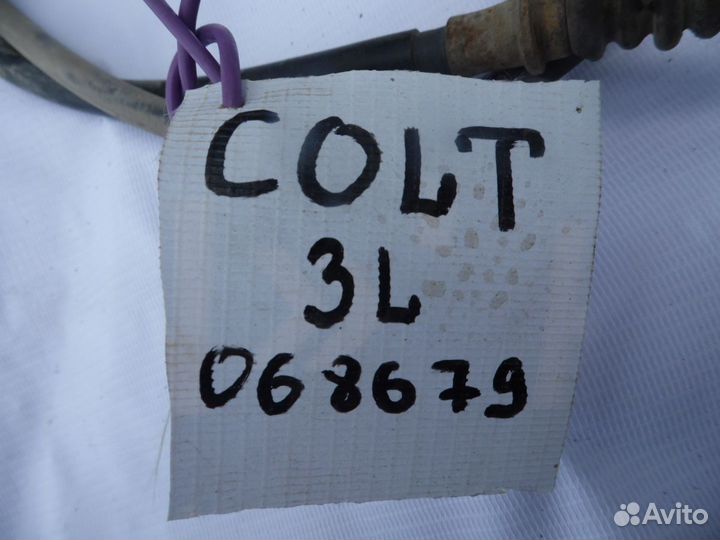 Трос стояночного тормоза левый Mitsubishi Colt (Z3