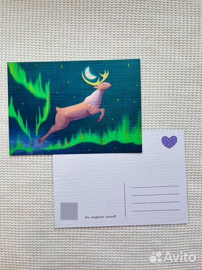 Почтовая открытка с оленем и северным сиянием