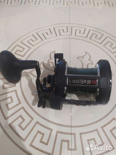 Катушка рыболовная инерционная