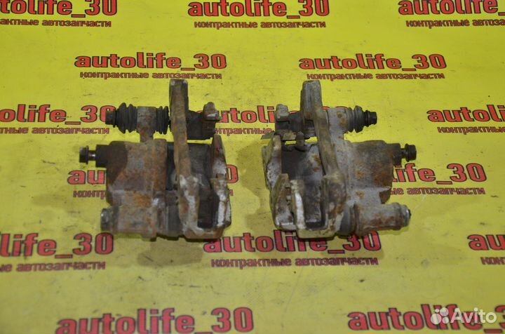 Суппорт тормозной задний Toyota Carina ED ST202