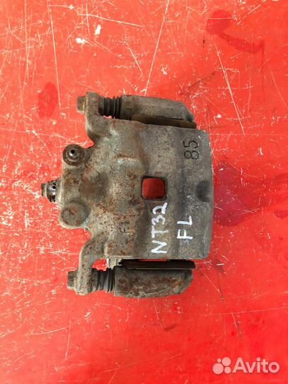 Суппорт тормозной передний левый Nissan Teana J32