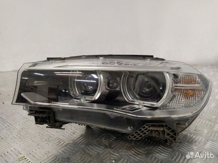 Фара биксеноновая левая Bmw X5 3.0D