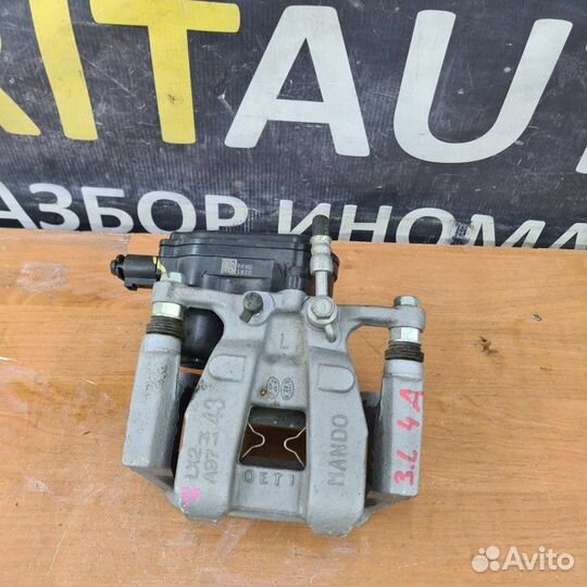 Суппорт тормозной задний левый Kia Mohave 2