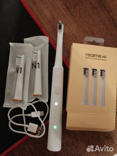 Электрическая зубная щетка