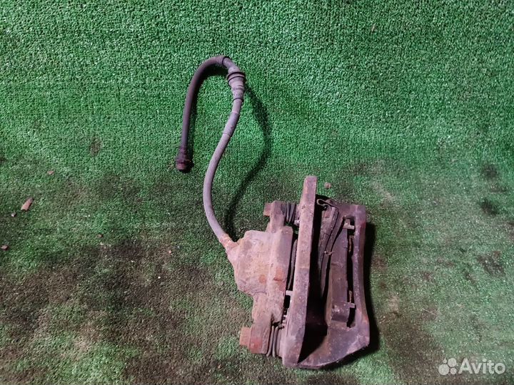 Суппорт тормозной передний Kia Spectra I рестайлин