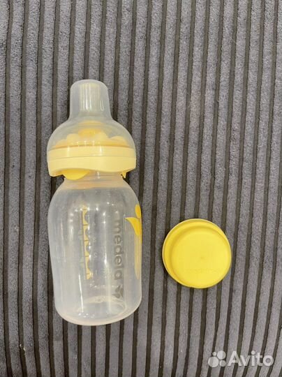 Молокоотсос Medela Swing Flex + бутылка Calma