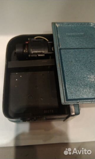 Кинокамера 1960-х годов и фотоальбом