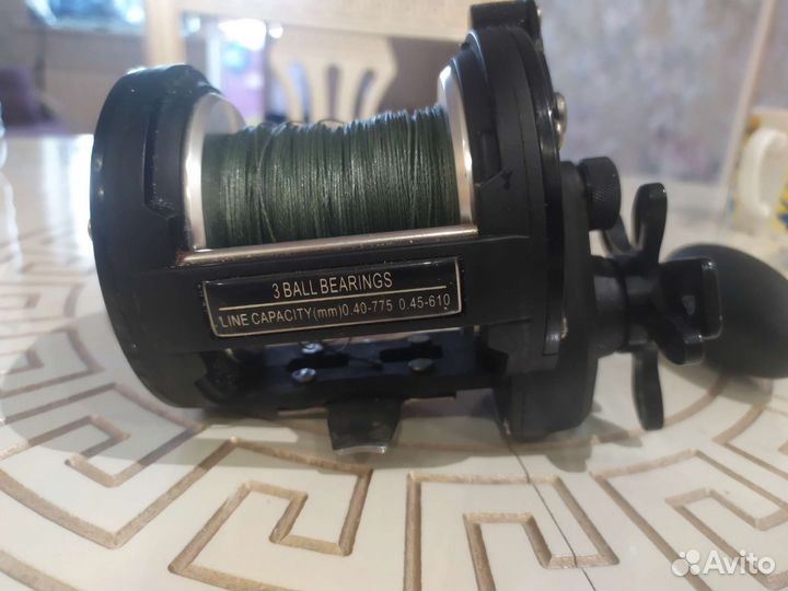 Катушка рыболовная инерционная