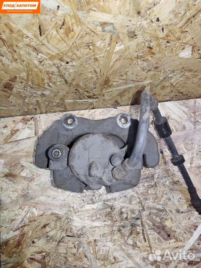 Суппорт тормозной передний левый Mazda 3 BL