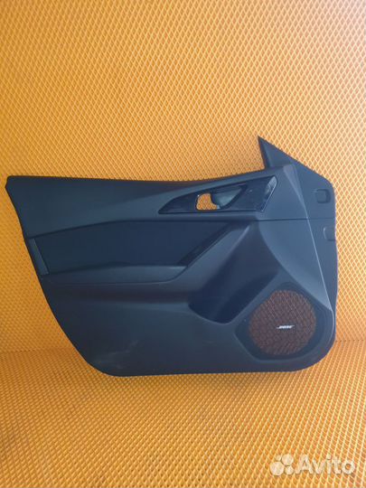 Обшивка двери передней левой Mazda 3 BM