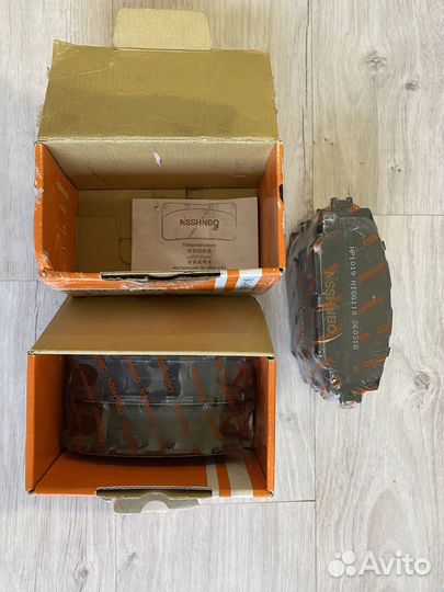 Nisshinbo передние колодки Toyota Corolla е150