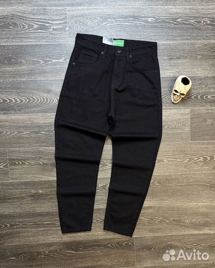 Джинсы Lacoste