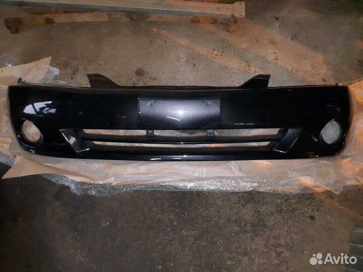 Бампер черный Kia Spectra