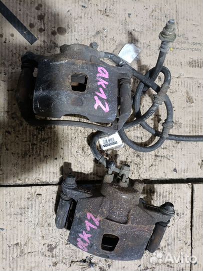 Суппорт передний Nissan March AK12