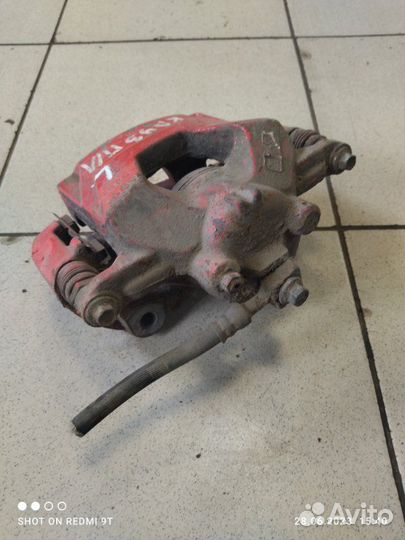 Суппорт тормозной передний левый Chevrolet Cruze