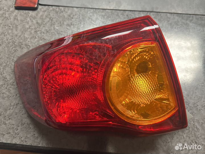 Задний фонарь левый Toyota Corolla 150
